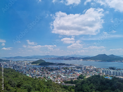 This is an aerial shot of downtown Mokpo, with the sea visible in the distance. © binimin