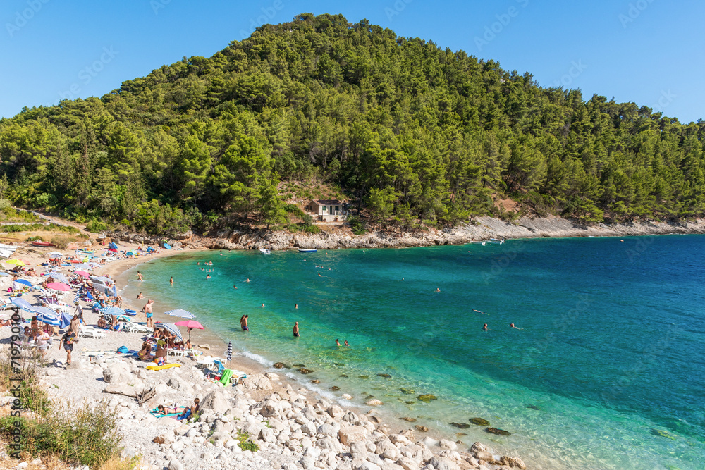 People on beach in Pupnatska luka cove on Korcula island, Croatia