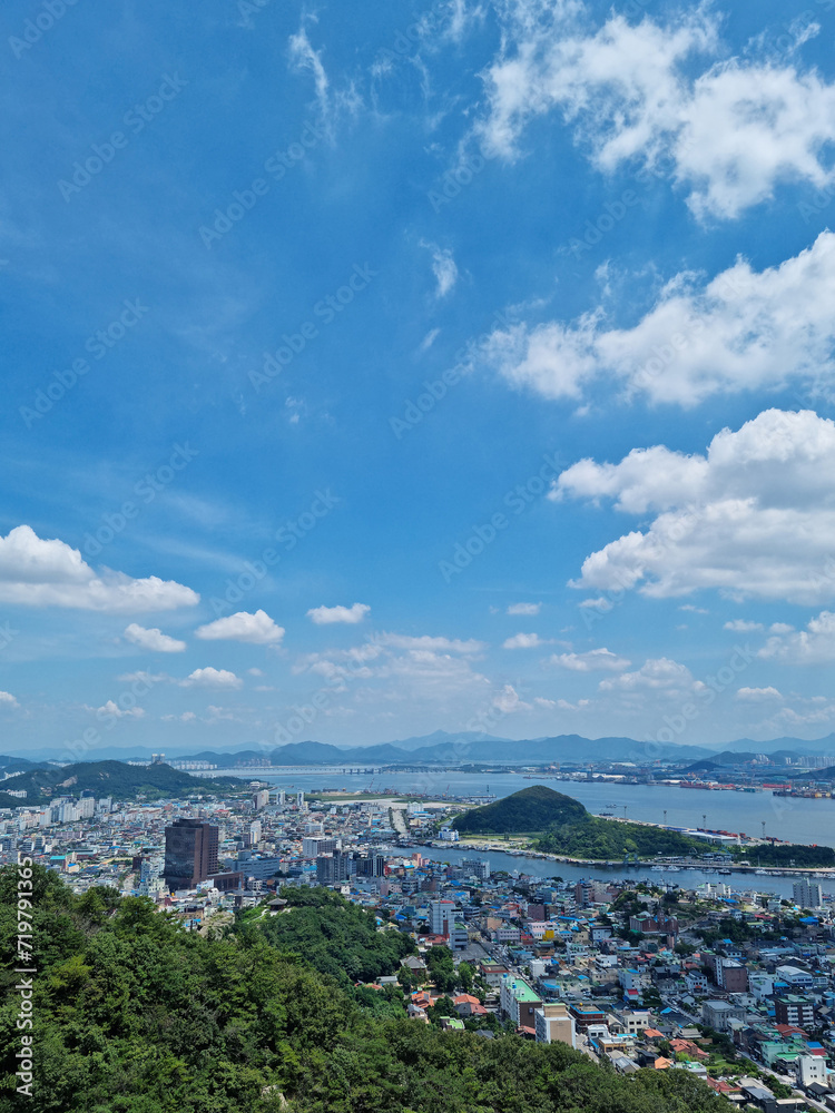 This is a view of downtown Mokpo, South Korea, with the sea and sky.