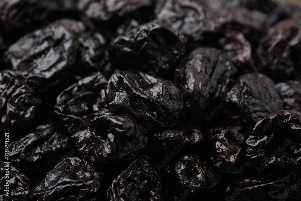 Sweet dried prunes as background, closeup view Sweet dried prunes as background, closeup view