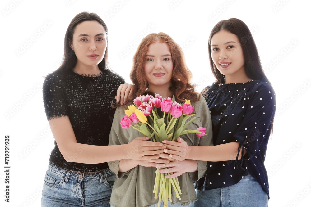 Young women with bouquet of beautiful tulips on white background. International Women's Day Young women with bouquet of beautiful tulips on white background. International Women's Day