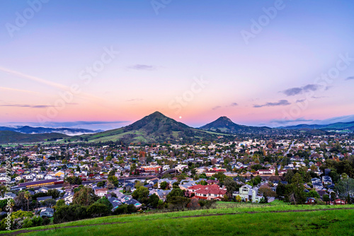 View of City, town and mountain peaks at dawn, dusk, sunrise, sunset