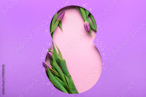 Cut purple paper in shape of figure 8 with beautiful tulips on pink background