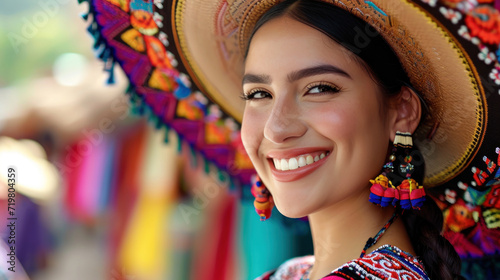 Beautiful Mexican woman smiling wearing Mexican Hat in the traditional dress