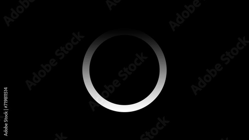 Loading, buffering white gradient circle animation on a black background. Seamless loop video of rotating, spinning circle for signal, data, video stream, transfer technology, or computer concept photo