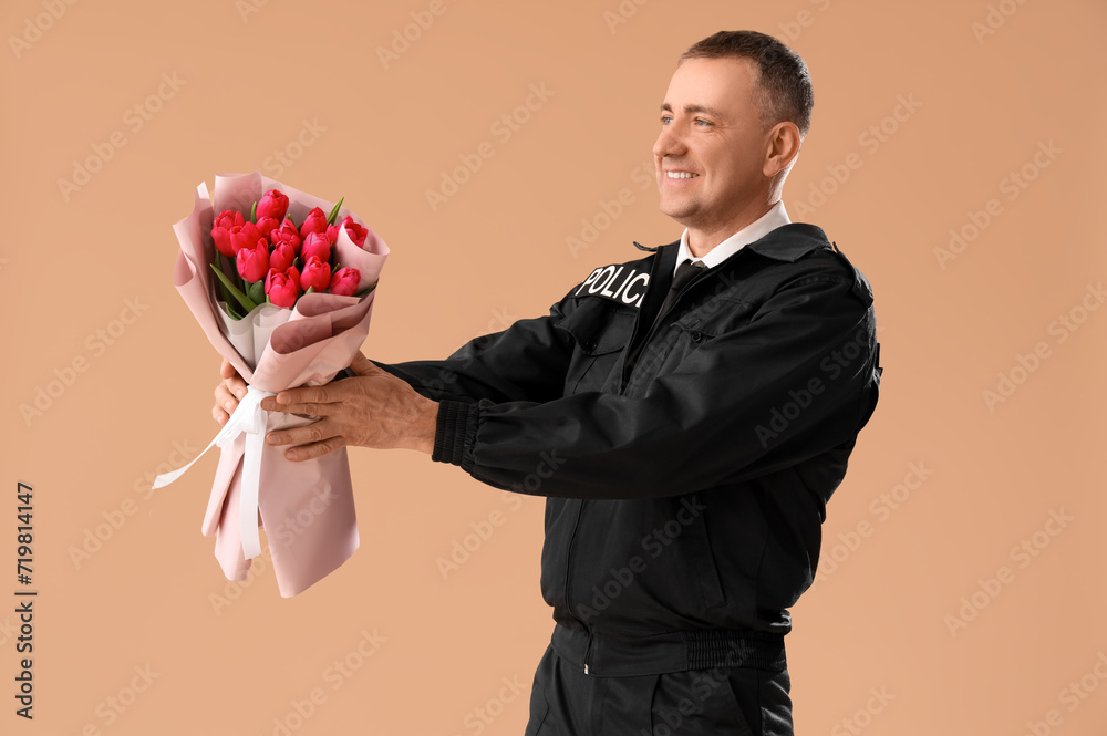 Policeman with flowers on beige background. International Women's Day Policeman with flowers on beige background. International Women's Day