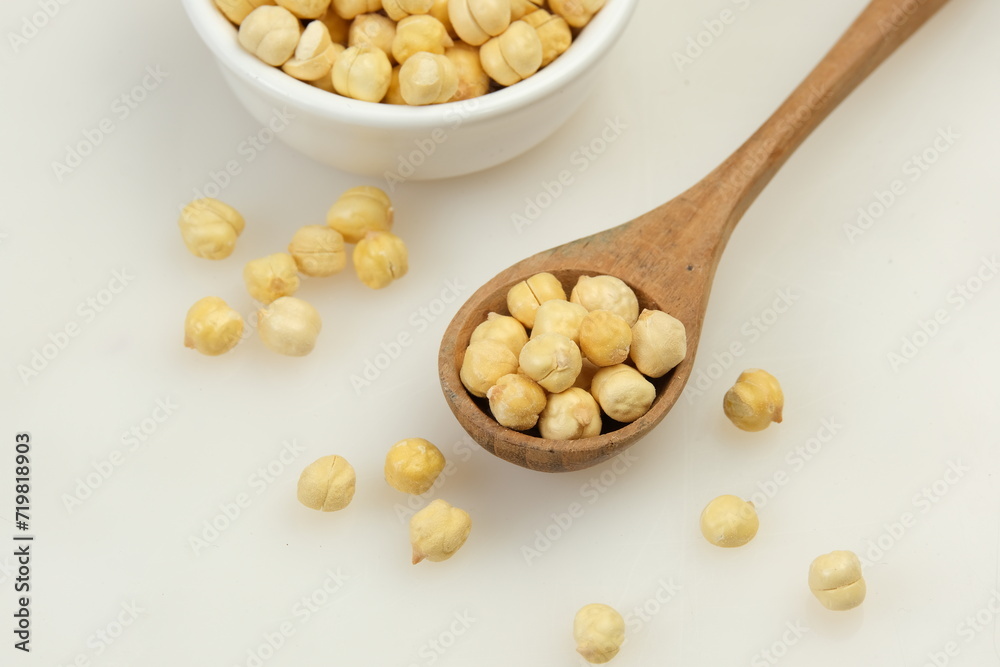 Chickpeas in wooden spoon Isolated on White Background Chickpeas in wooden spoon Isolated on White Background