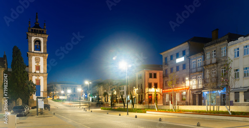 Scenic night view of landscaped Carvalho Araujo Avenue in Portuguese city of Vila Real overlooking bell tower of S. Domingos Convent Church in spring photo