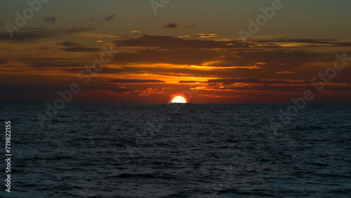 Coastal evening landscape. Beautiful dusk sky over ocean