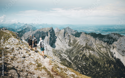 Three hikers at Hochplatte, Ammergauer Alps photo