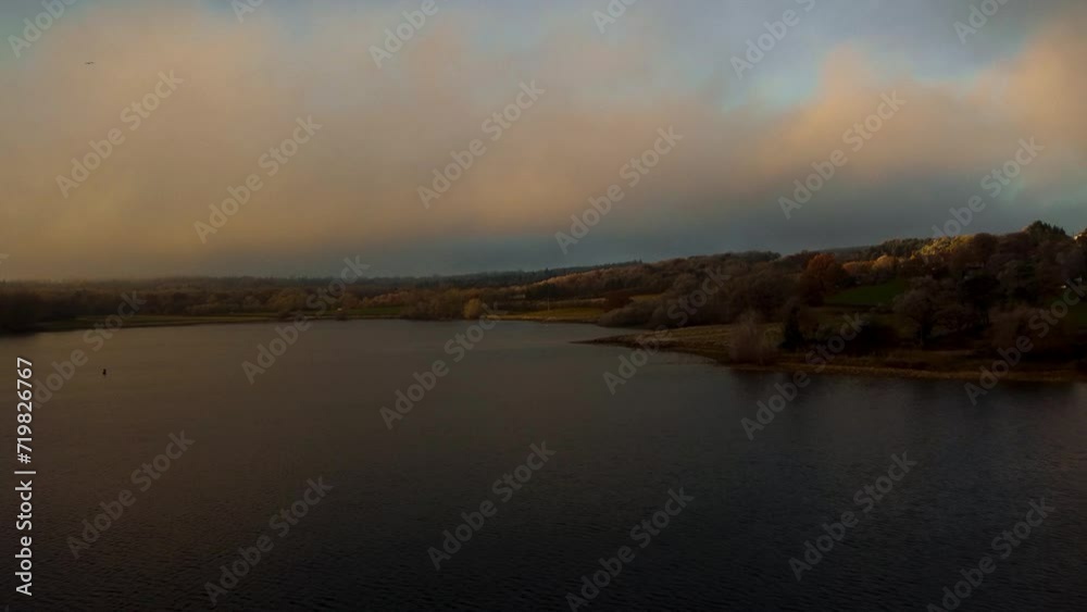 Aerial view 4k birds eye view of Rutland water in Rutland England UK. Clear blue skies on a cold day with clear waters and water fowl. Aerial view 4k birds eye view of Rutland water in Rutland England UK. Clear blue skies on a cold day with clear waters and water fowl.