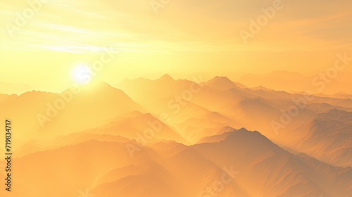 Golden sunrise illuminating the misty mountains.