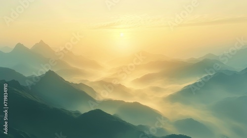 Golden sunrise illuminating the misty mountains.