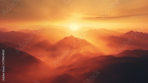 Golden sunrise illuminating the misty mountains. © Media Srock