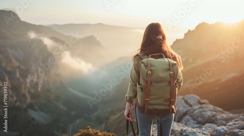 Hipster young girl with backpack enjoying sunset on peak of foggy mountain. Tourist traveler on background view mockup. Hiker looking sunlight in trip in Spain country, mock up text. P : Generative AI photo