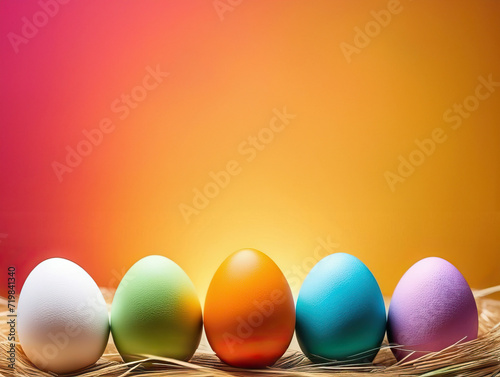 Easter colorful eggs stand in a row on a bright background with space for text on top. Happy Easter holiday concept