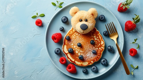 An appetizer with a sweet bear-made pancake and a pale blue backdrop, space, Generative AI.