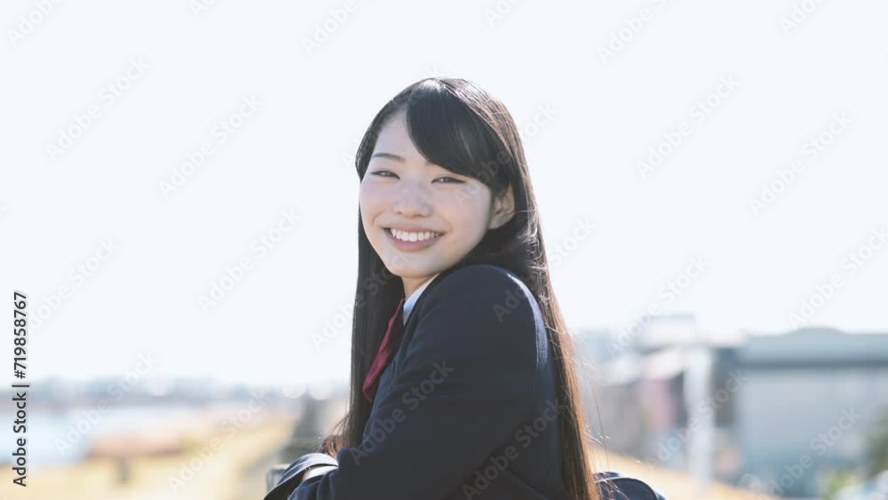 High school girl with blue sky background Slow video with camera-eye view of image of goals, future and hope High school student series with transparency