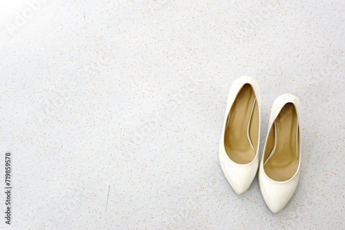 a pair of white high heels shoes ( stilettos )