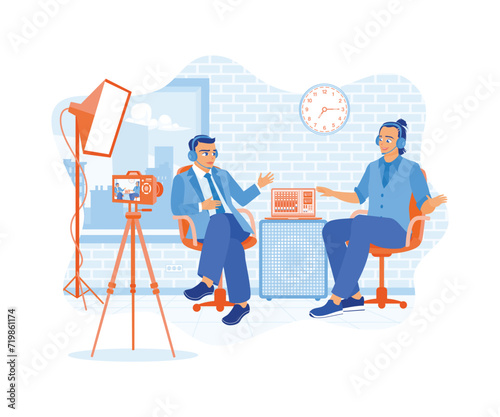 The vlogger makes a podcast with a man in the studio. Content creators broadcast their conversations live on social media. Content Creator concept. Flat vector illustration.