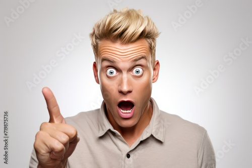 handsome blond man with bristle, looking surprised pointing himself,  © CStock