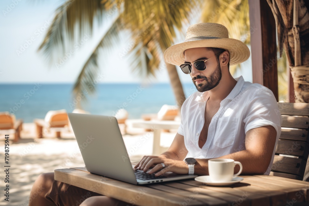 men and travel,Handsome relaxed man using laptop, beach background, 