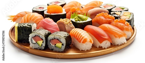 Party tray with sashimi, sushi and maki rolls, shallow focus