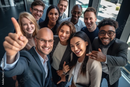 group of professional work friends taking a picture at modern workplace 