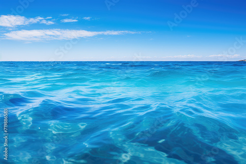 Tropical beach with turquoise water and blue sky background