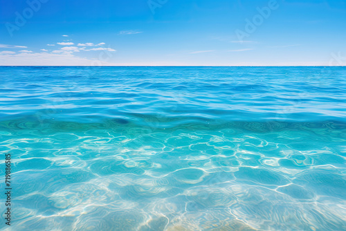 Tropical beach with turquoise water and blue sky background