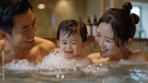 Asian family enjoying bathing activity