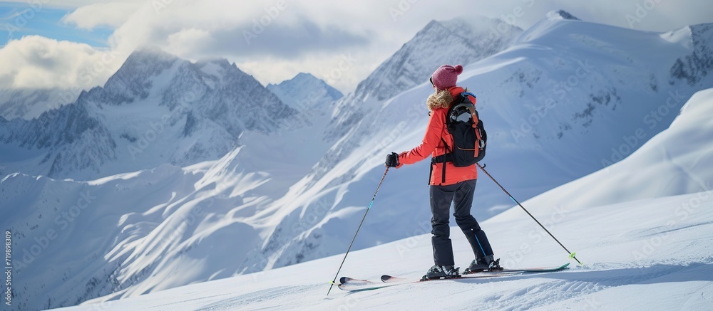 a woman ice skiing in the snow mountains
