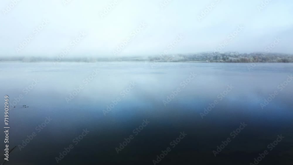 Aerial view 4k birds eye view of Rutland water in Rutland England UK. Clear blue skies on a cold day with clear waters and water fowl. Aerial view 4k birds eye view of Rutland water in Rutland England UK. Clear blue skies on a cold day with clear waters and water fowl.