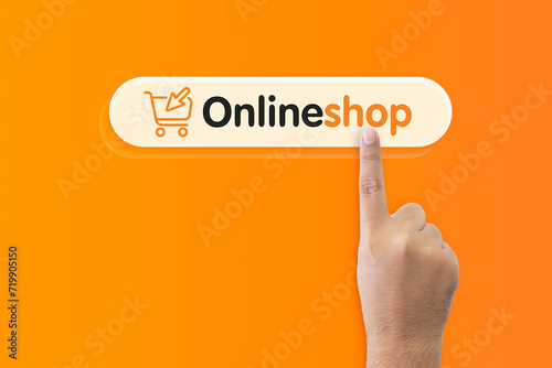 Close-up man's hand uses his finger to press buttons online shopping offers, isolated on orange background. Concept of Marketing, Shopping, technology, connection.