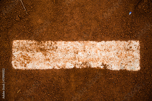 red clay baseball field and various views of the baseball home plate