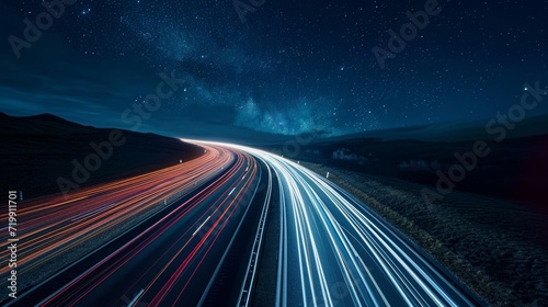 The remote road is transformed into a magical journey through the stars thanks to the dramatic and captivating light trails left in the wake of ping cars. photo
