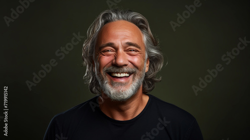 Happy smiling middle aged adult man on a solid background