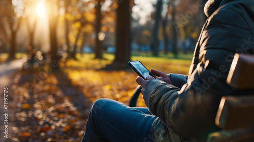 Person hält Smartphone in beiden Händen sitzend Ausschnitt vom Schoss auf einer Bank oder Sofa Generative AI photo