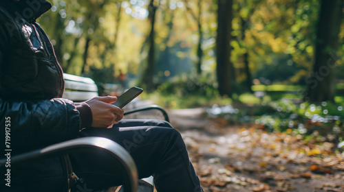 Person hält Smartphone in beiden Händen sitzend Ausschnitt vom Schoss auf einer Bank oder Sofa Generative AI photo
