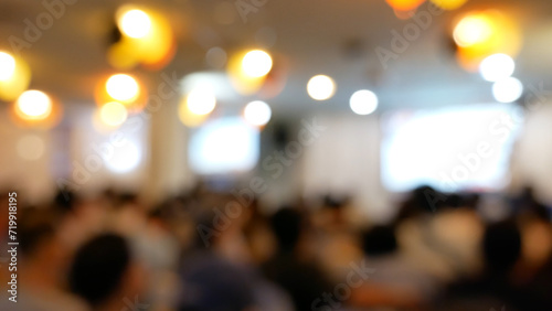 Blurred background people join seminar business event in auditorium hall convention. Presentation meeting at conference room present screen business. Blurred background with copy space