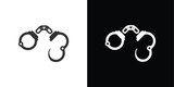 handcuffs on black and white background
