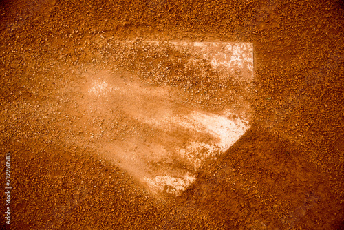 red clay baseball field and various views of the baseball home plate