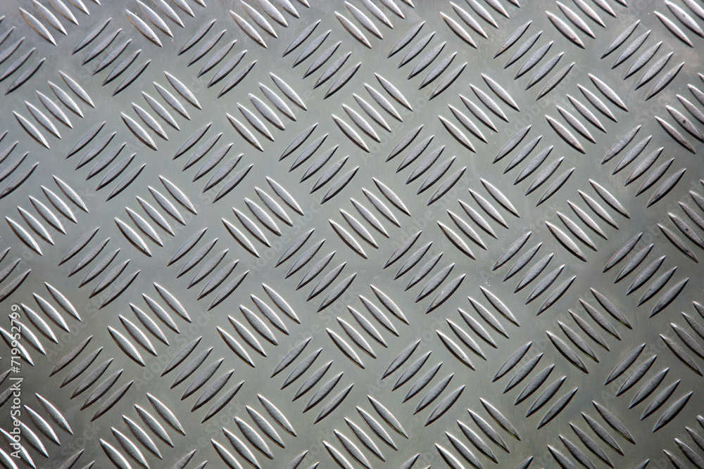 Weathered iron wall with seamless background of iron products Weathered iron wall with seamless background of iron products