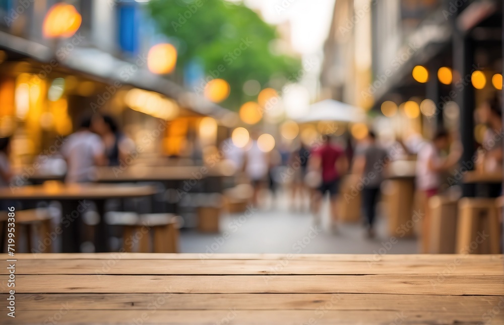 An empty wooden table on the background of street food courts, bokeh defocused background An empty wooden table on the background of street food courts, bokeh defocused background