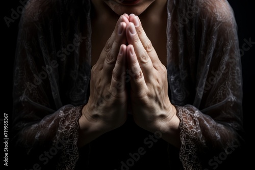 close up shot to a person's hand praying