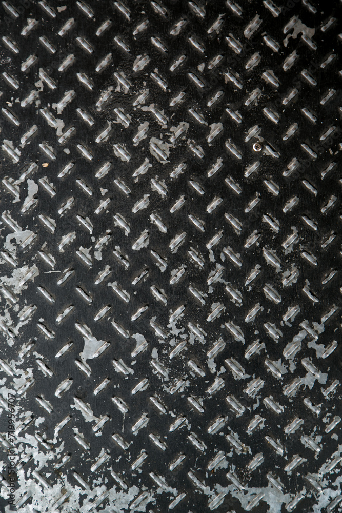 Weathered iron wall with seamless background of iron products Weathered iron wall with seamless background of iron products