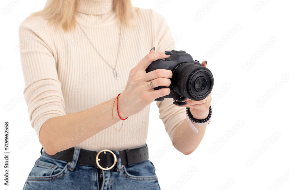 A girl with a camera takes pictures isolated on a white background A girl with a camera takes pictures isolated on a white background