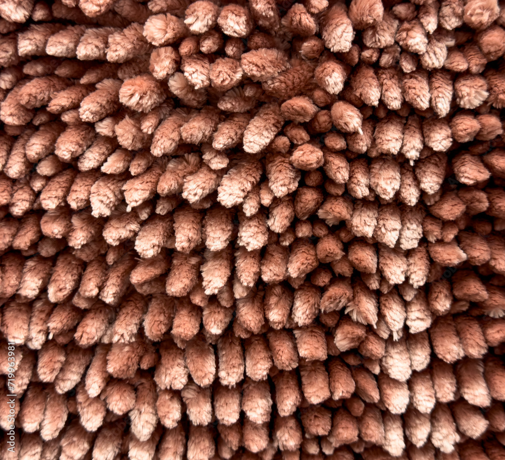 Brown terry carpet as an abstract background. Texture