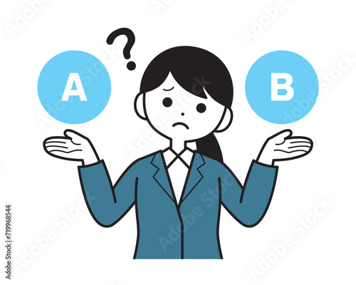 AとBを比較して迷っているスーツ姿の女性