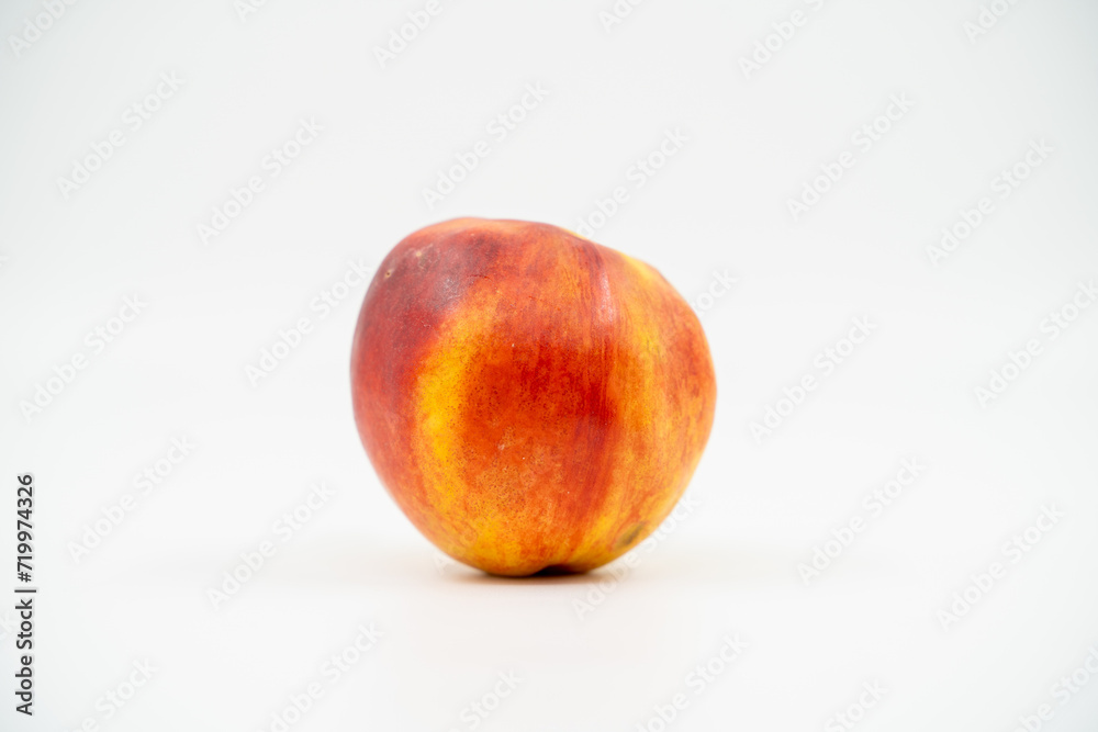 Peach nectarine close up on white background isolated. Peach nectarine close up on white background isolated.